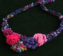 Crocheted and knitted purple and pink necklace